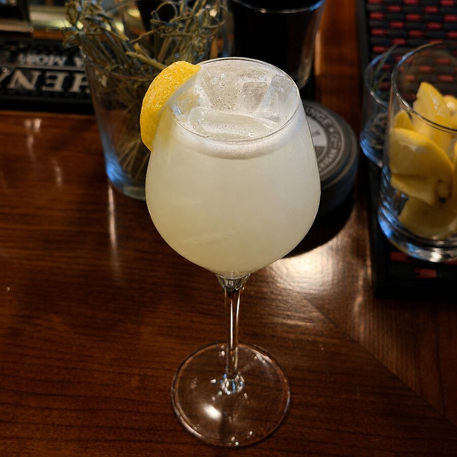 The Whisper in the Stacks cocktail at The Archive Lounge — French 76
