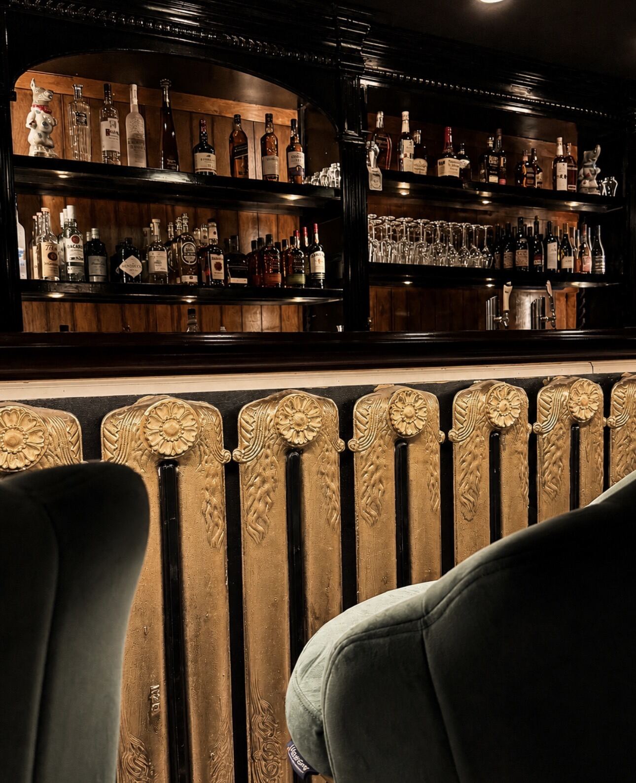 Carved back bar and velvet seat