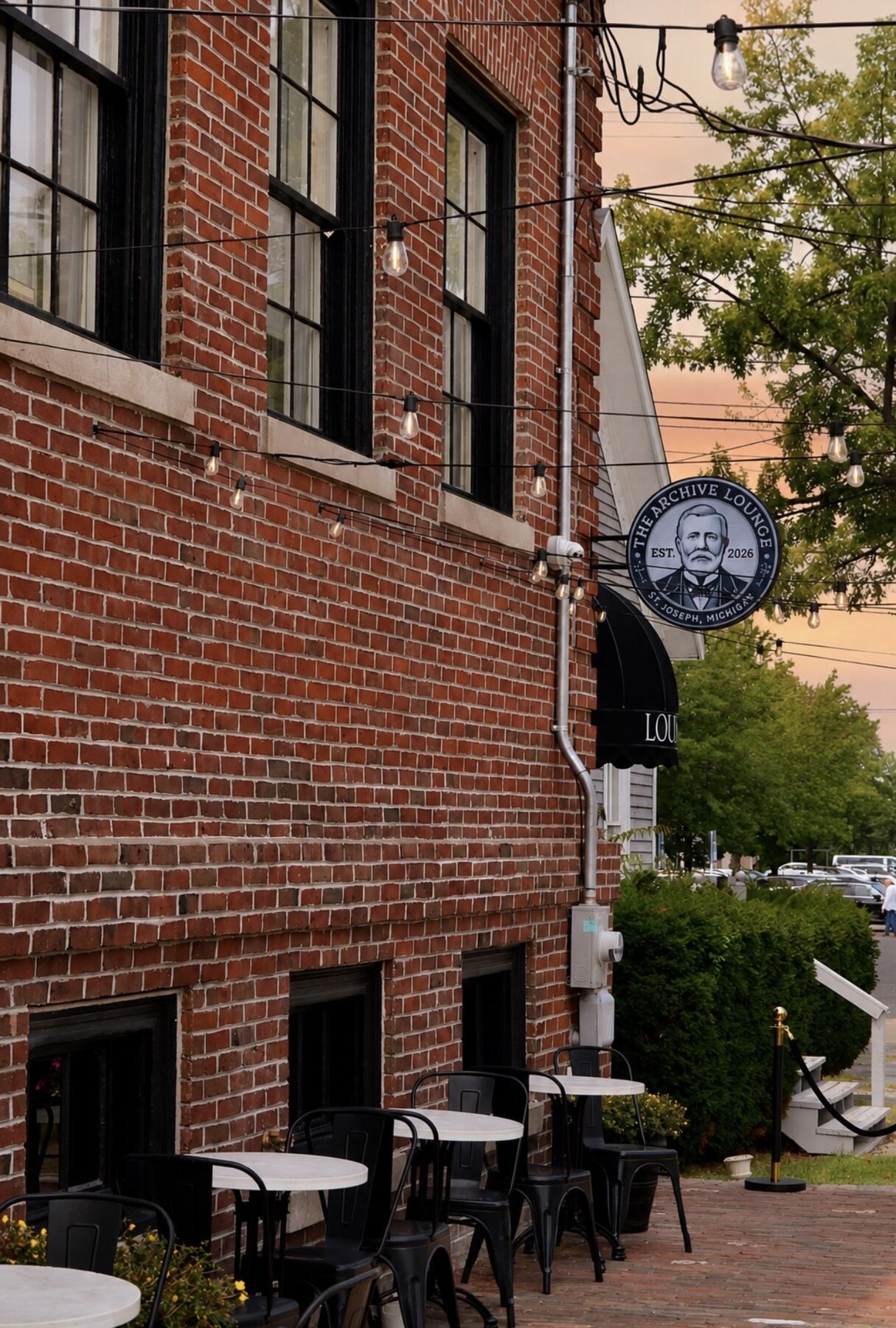 The vintage brick and wrought-iron patio outside The Archive Lounge in downtown St. Joseph, Michigan
