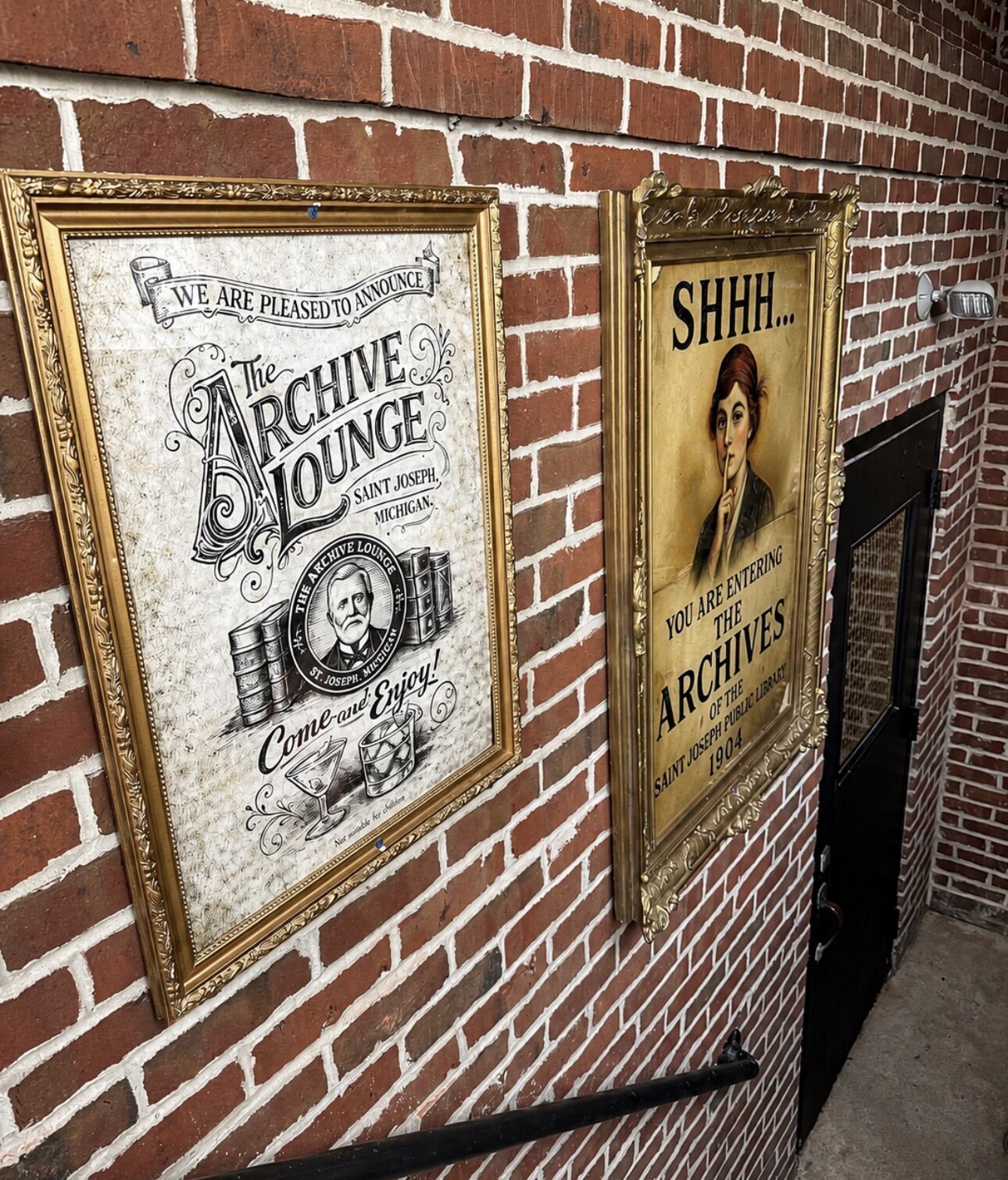 Framed lounge signs on original brick