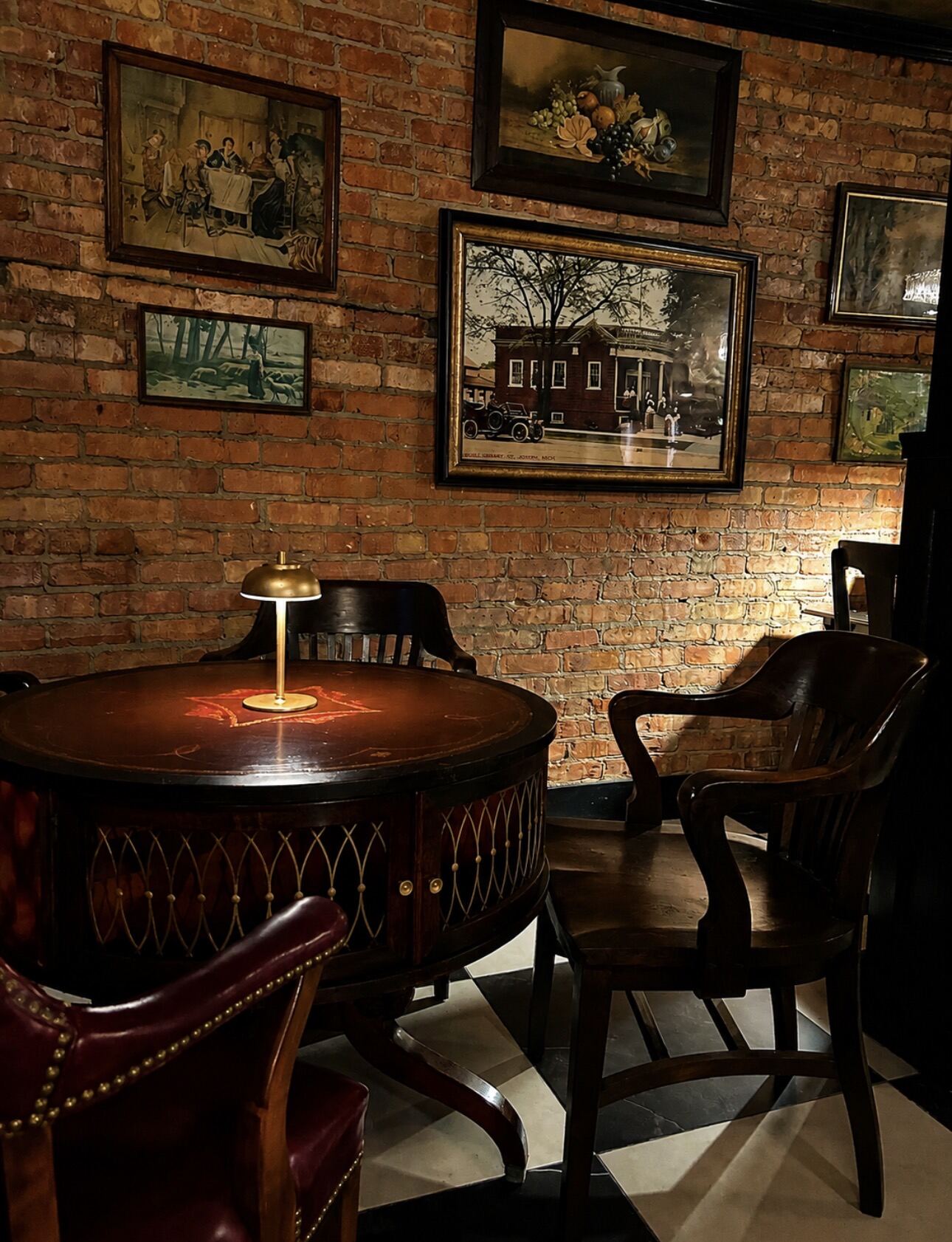 Round table against original brick